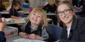 teacher helping student